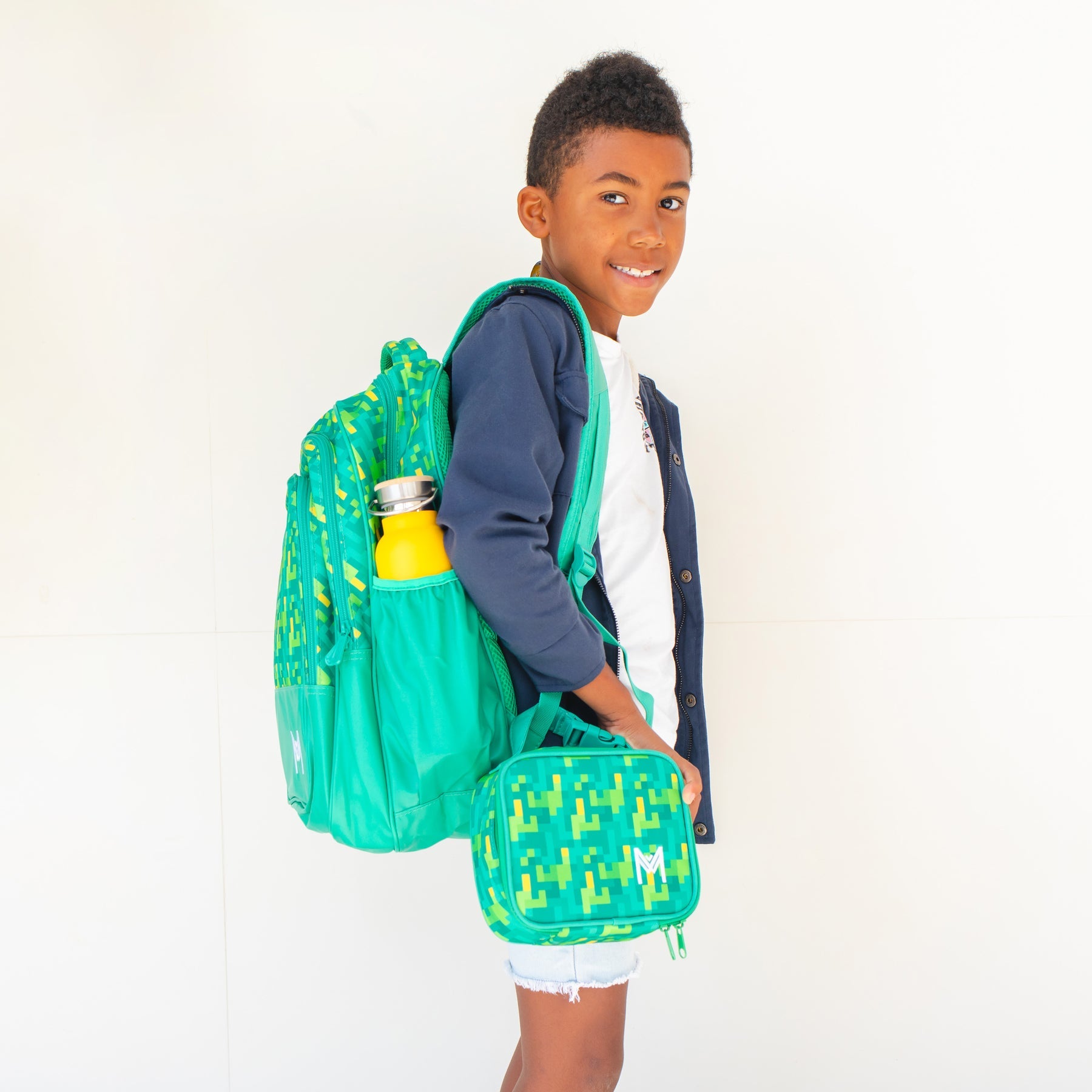 MontiiCo - Školský ruksak PIXELY len 700g!